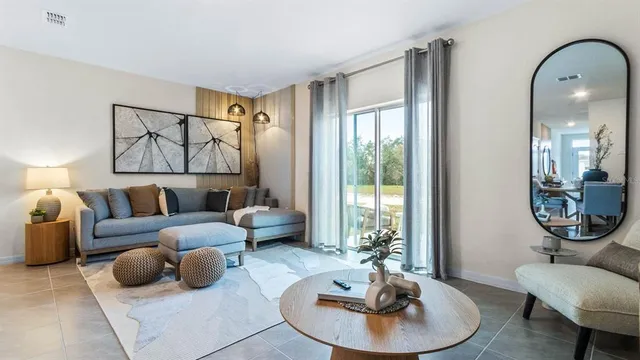 a living room with furniture and a large window