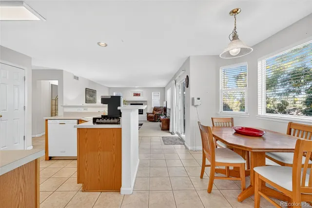 a view of a dining room with furniture and window