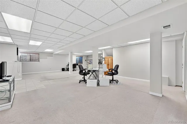 a room with gym equipment and a window