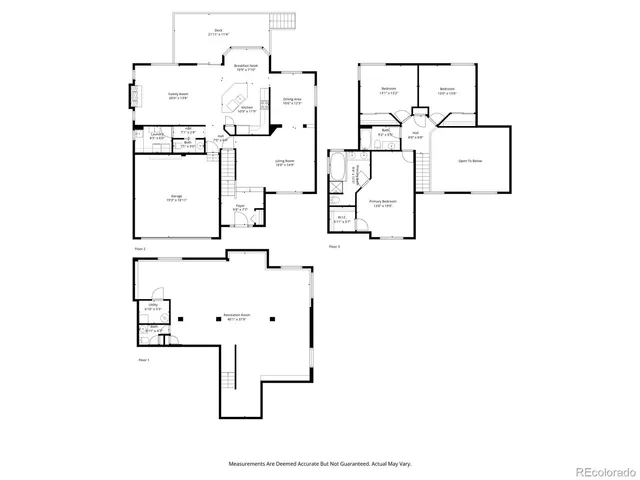 a view of a backyard with a large tree and wooden fence