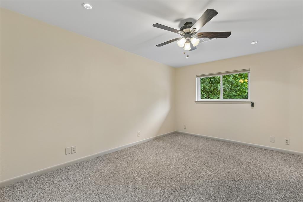 1548 Timbercreek Drive Howe, TX 75459 - Photo 17 of 24 an empty room with a ceiling fan and window