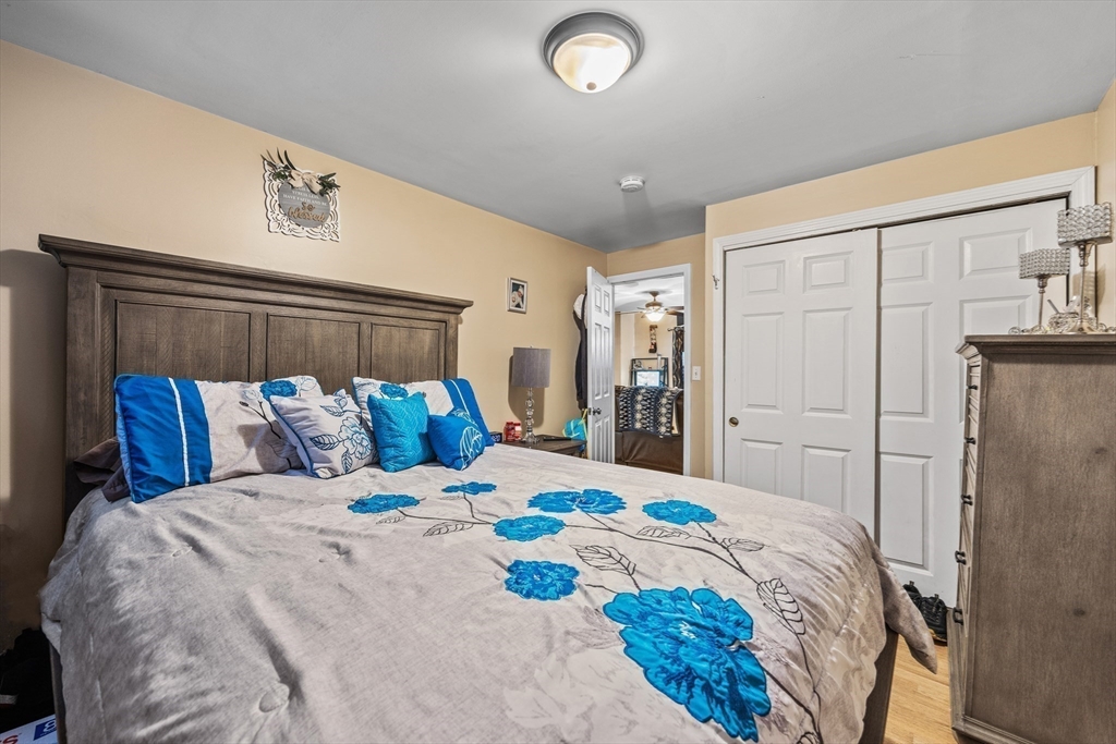233 East Main Street Fall River, MA 02724 - Photo 11 of 29 a bedroom with a large bed and a closet