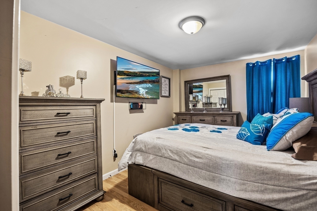 233 East Main Street Fall River, MA 02724 - Photo 12 of 29 a bedroom with a bed and a flat tv screen