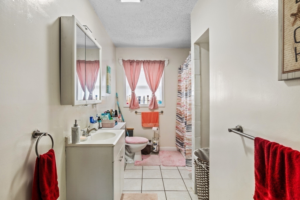 233 East Main Street Fall River, MA 02724 - Photo 19 of 29 a bathroom with a sink and a mirror