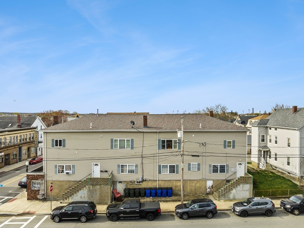 233 East Main Street Fall River, MA 02724 - Photo 2 of 29 a car parked in front of a building