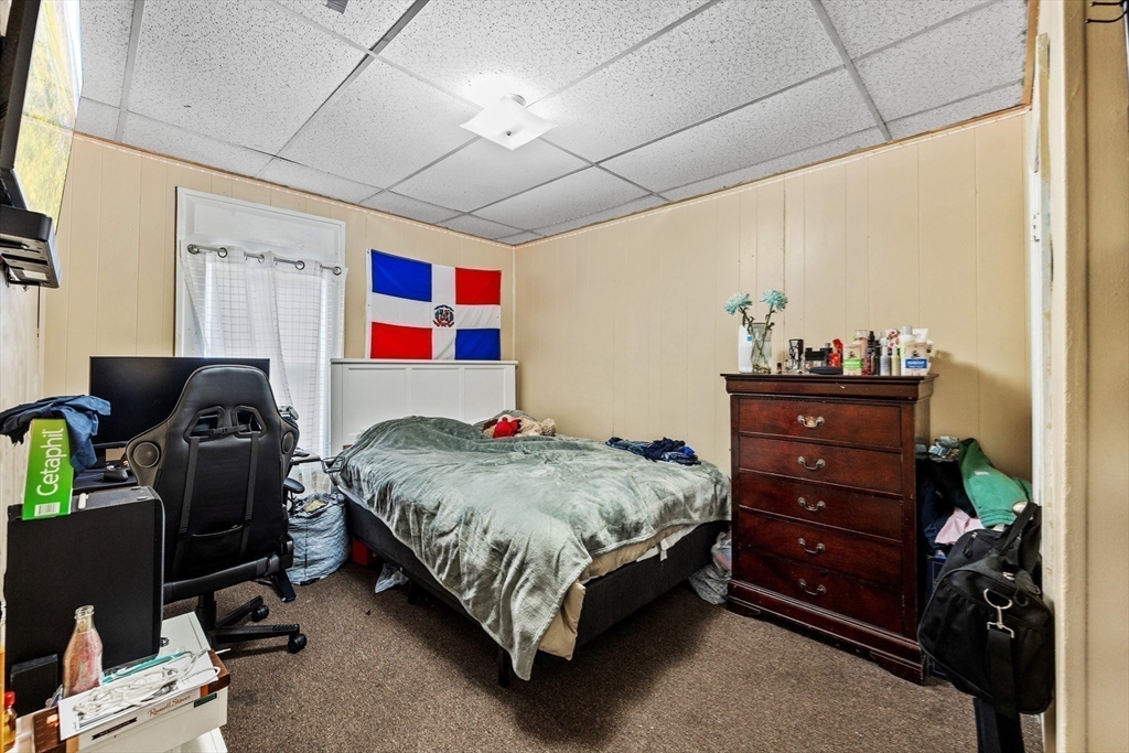 233 East Main Street Fall River, MA 02724 - Photo 21 of 29 a bedroom with a bed and dresser