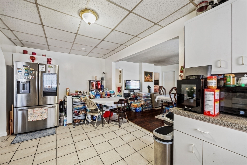 233 East Main Street Fall River, MA 02724 - Photo 22 of 29 a kitchen with refrigerator and cabinets