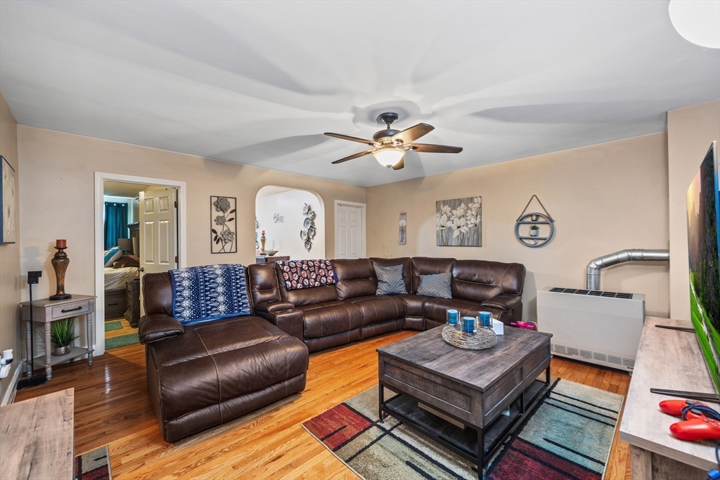 233 East Main Street Fall River, MA 02724 - Photo 7 of 29 a living room with furniture ceiling fan and a rug
