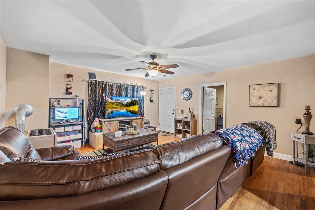 233 East Main Street Fall River, MA 02724 - Photo 9 of 29 a living room with furniture and wooden floor