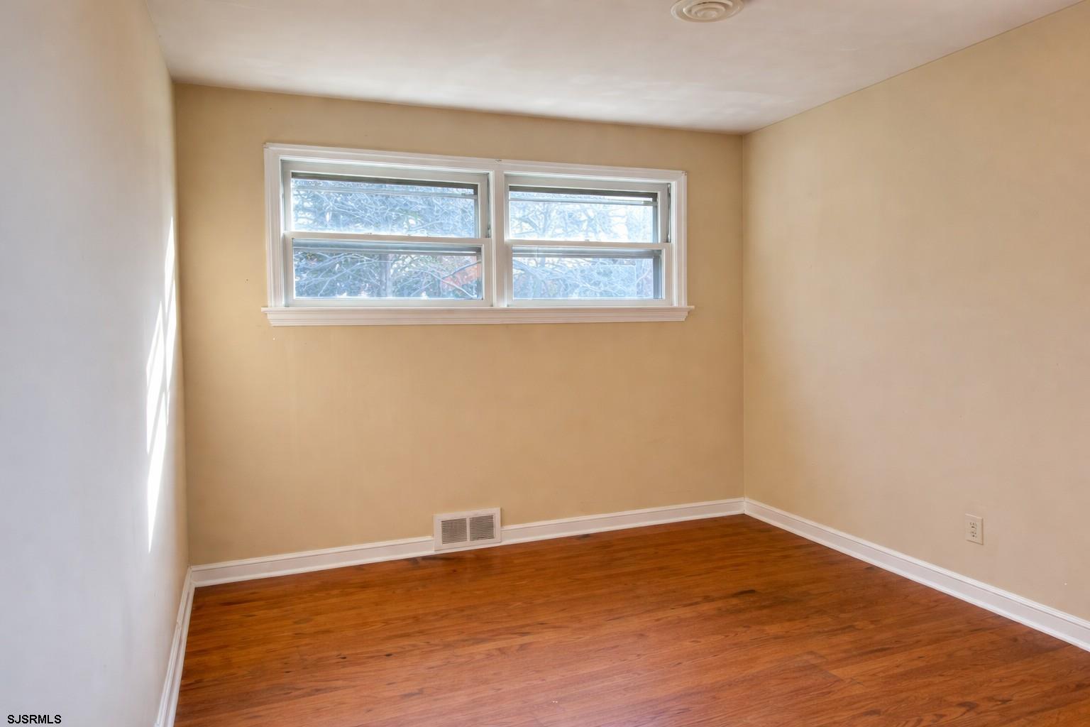 29 Summit Avenue Absecon, NJ 08201 - Photo 14 of 25 an empty room with a window