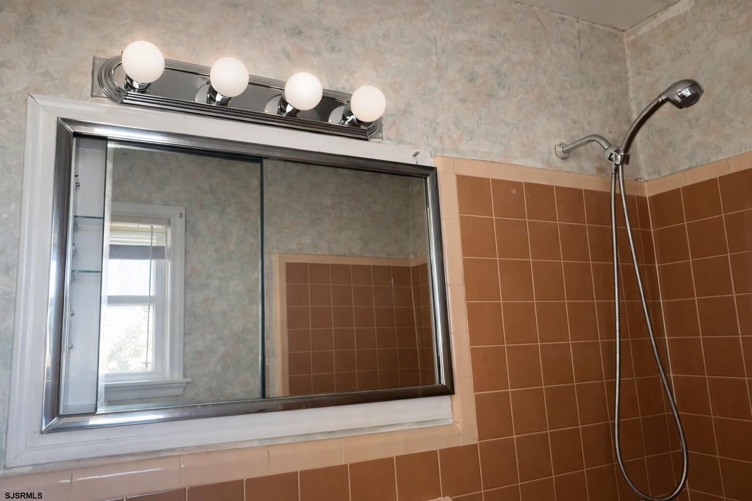29 Summit Avenue Absecon, NJ 08201 - Photo 22 of 25 a bathroom with a sink and mirror