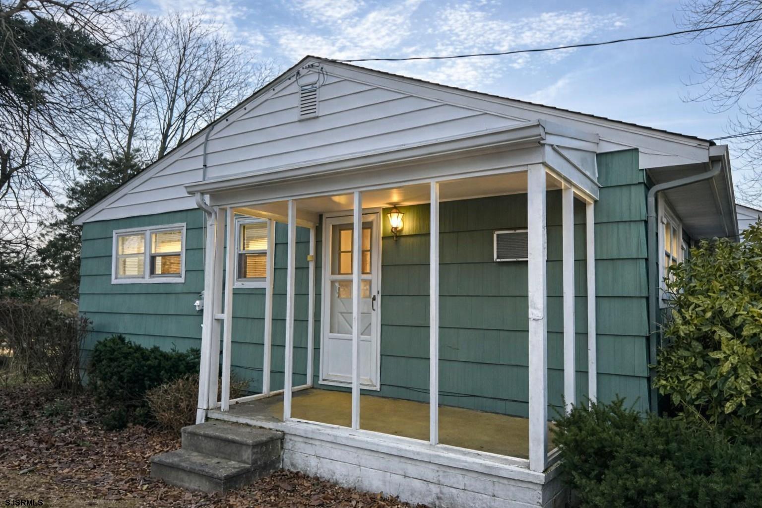 29 Summit Avenue Absecon, NJ 08201 - Photo 25 of 25 a view of house with a large window and potted plants