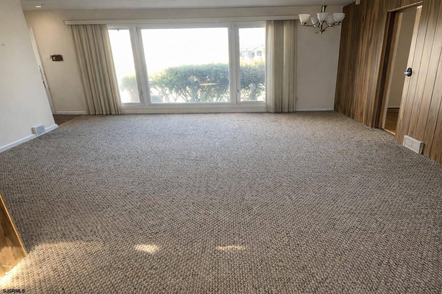 29 Summit Avenue Absecon, NJ 08201 - Photo 7 of 25 an empty room with windows and a yard