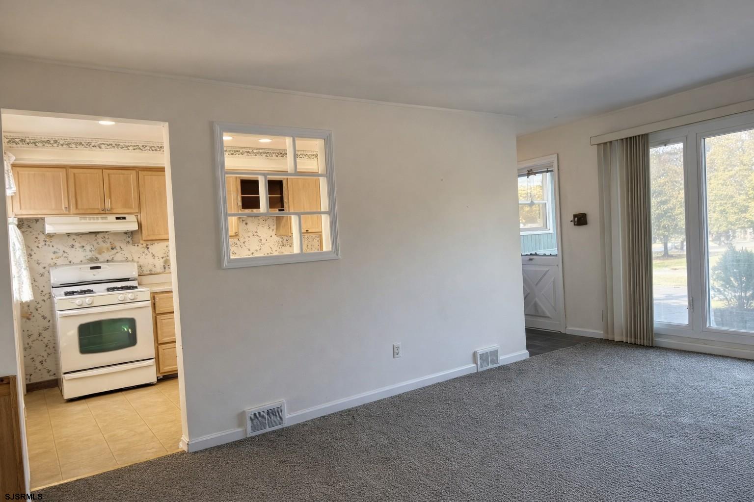 29 Summit Avenue Absecon, NJ 08201 - Photo 8 of 25 a view of a kitchen with an entryway and a stove