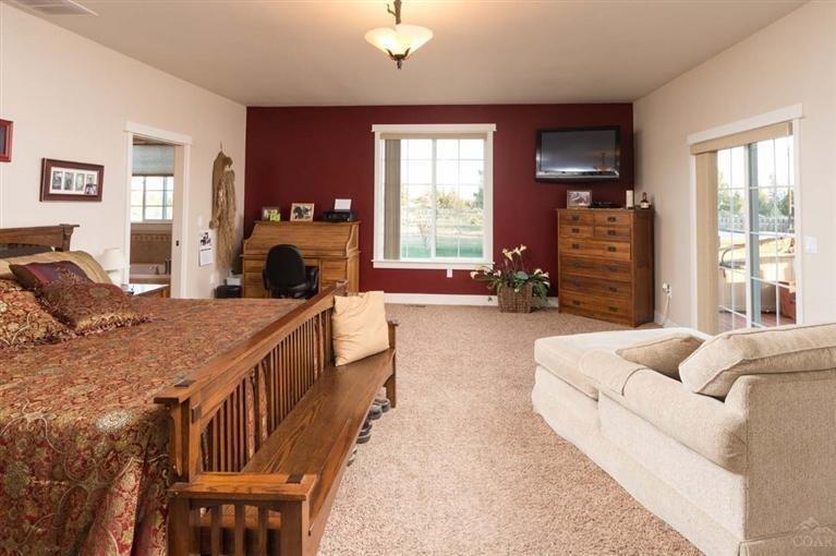 7098 Northwest Rainbow Road Terrebonne, OR 97760 - Photo 8 of 25 Large Master bedroom with doors to deck