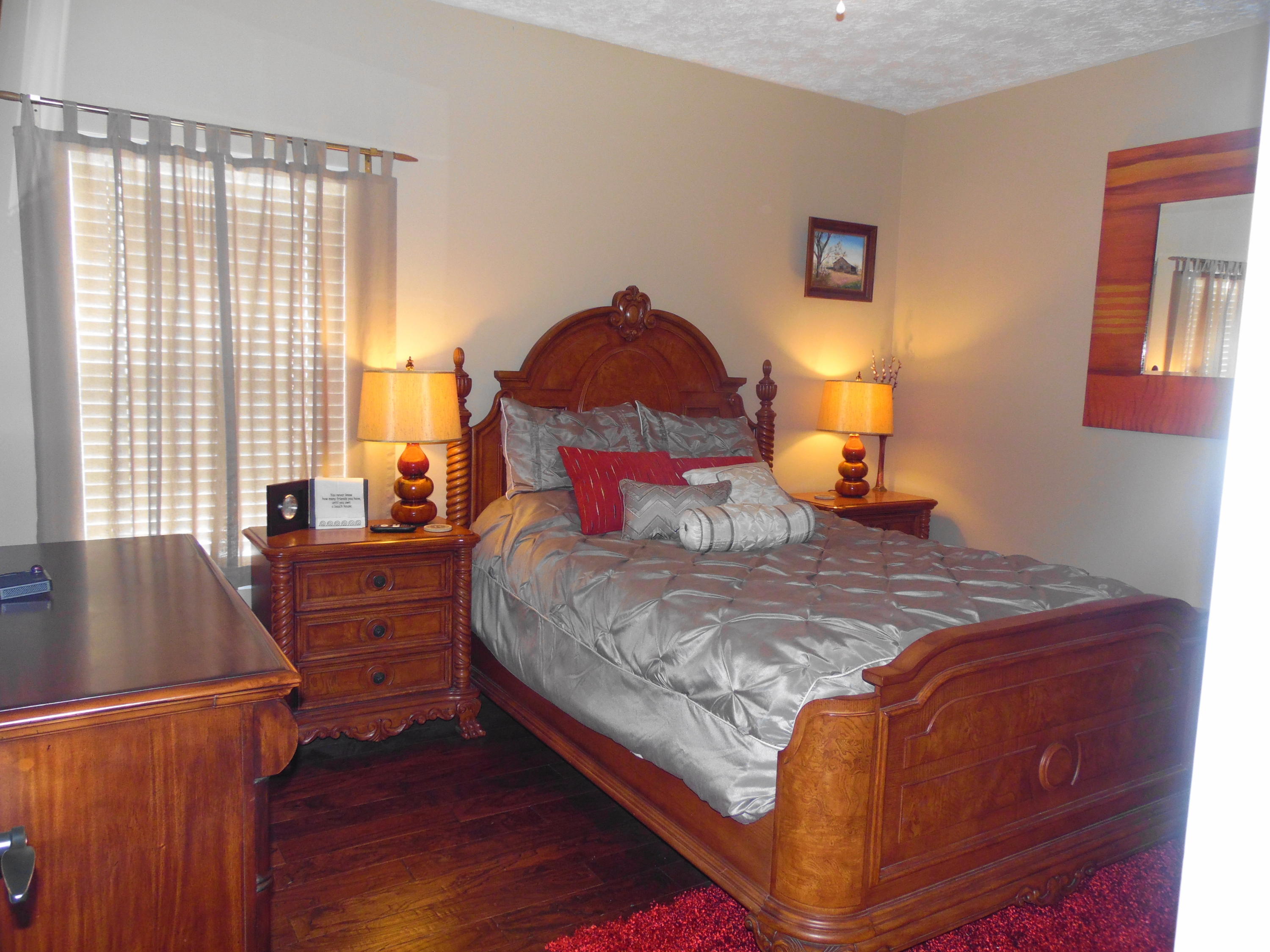 617 Tropical Way Freeport, FL 32439 - Photo 16 of 39 a bedroom with a bed and window