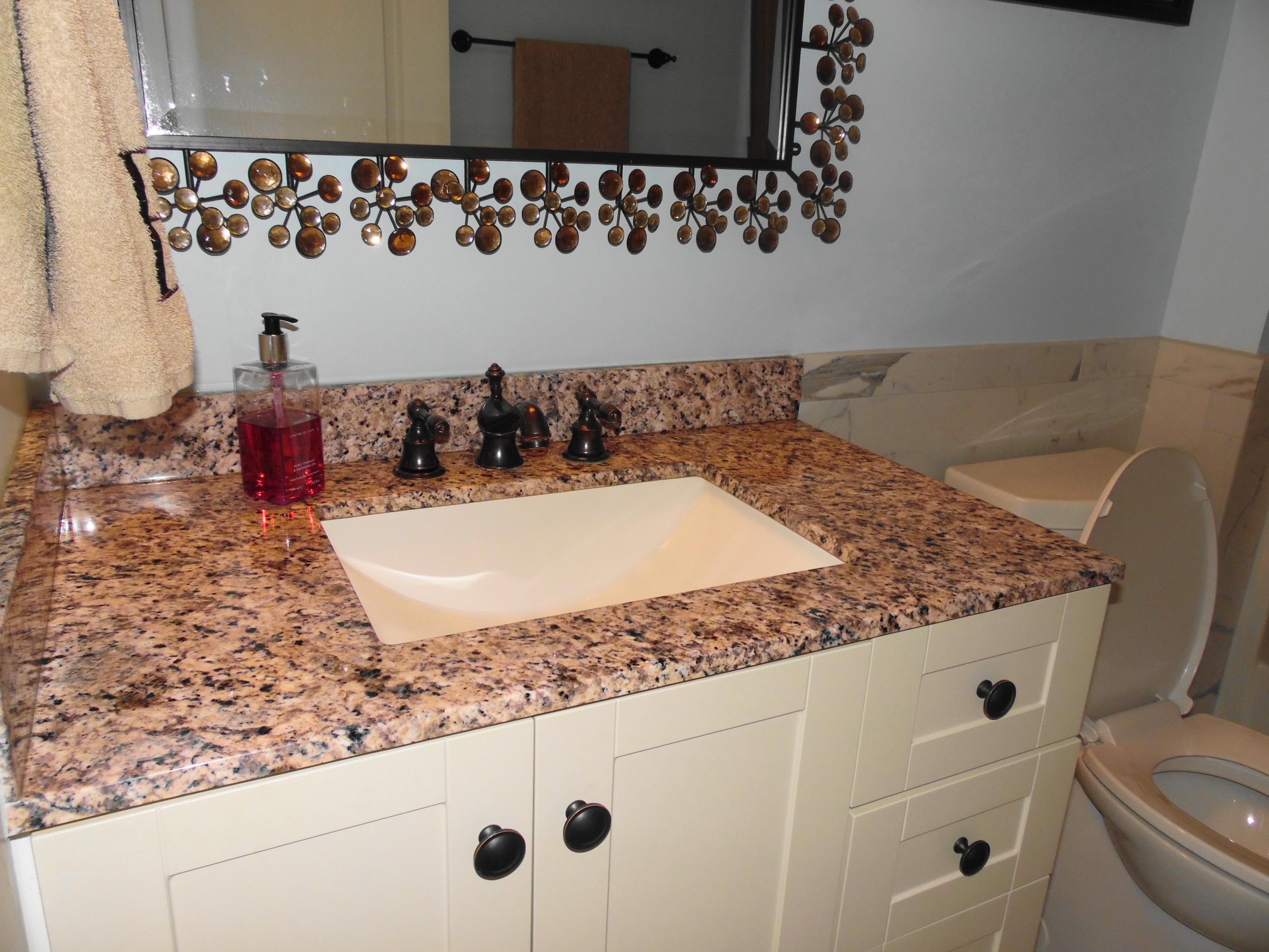 617 Tropical Way Freeport, FL 32439 - Photo 18 of 39 view of a bathroom with a sink and mirror