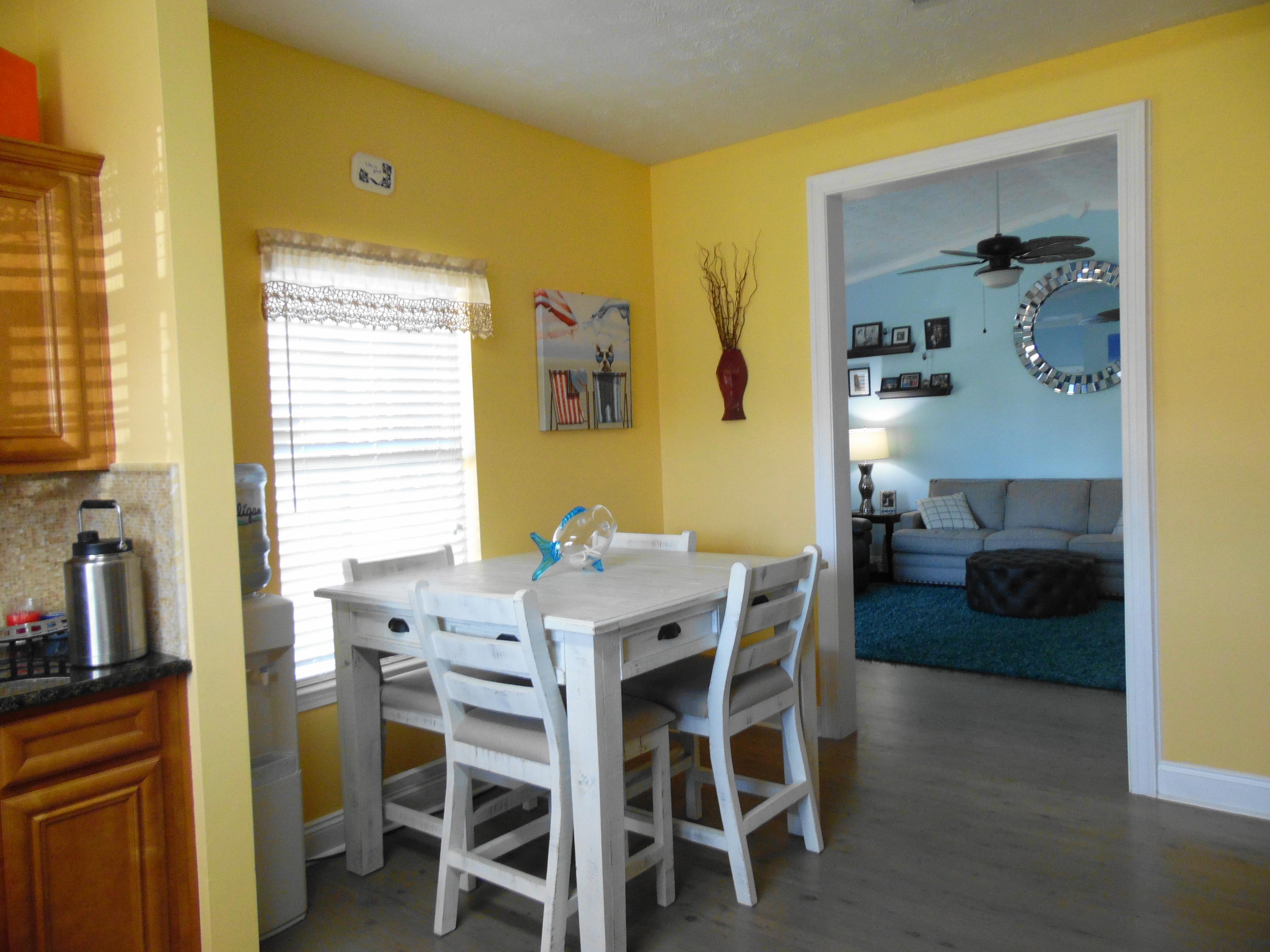 617 Tropical Way Freeport, FL 32439 - Photo 5 of 39 a view of a dining room with furniture and a window