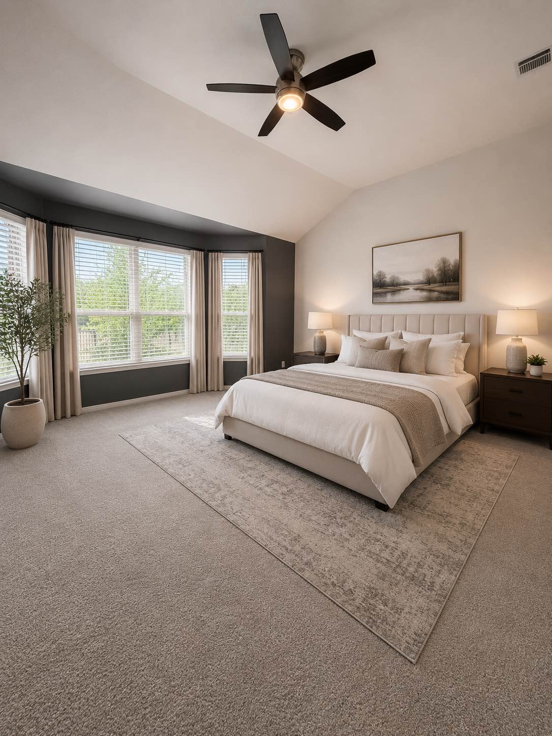 11306 Runnel Ridge Road Manor, TX 78653 - Photo 9 of 15 Soaring vaulted ceilings and a bay window illuminate this inviting, carpeted primary bedroom.