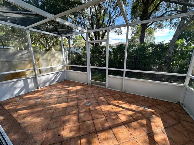 a view of outdoor space with a car garage