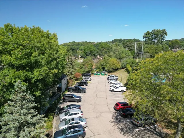 a view of a swimming pool with an outdoor space and seating area