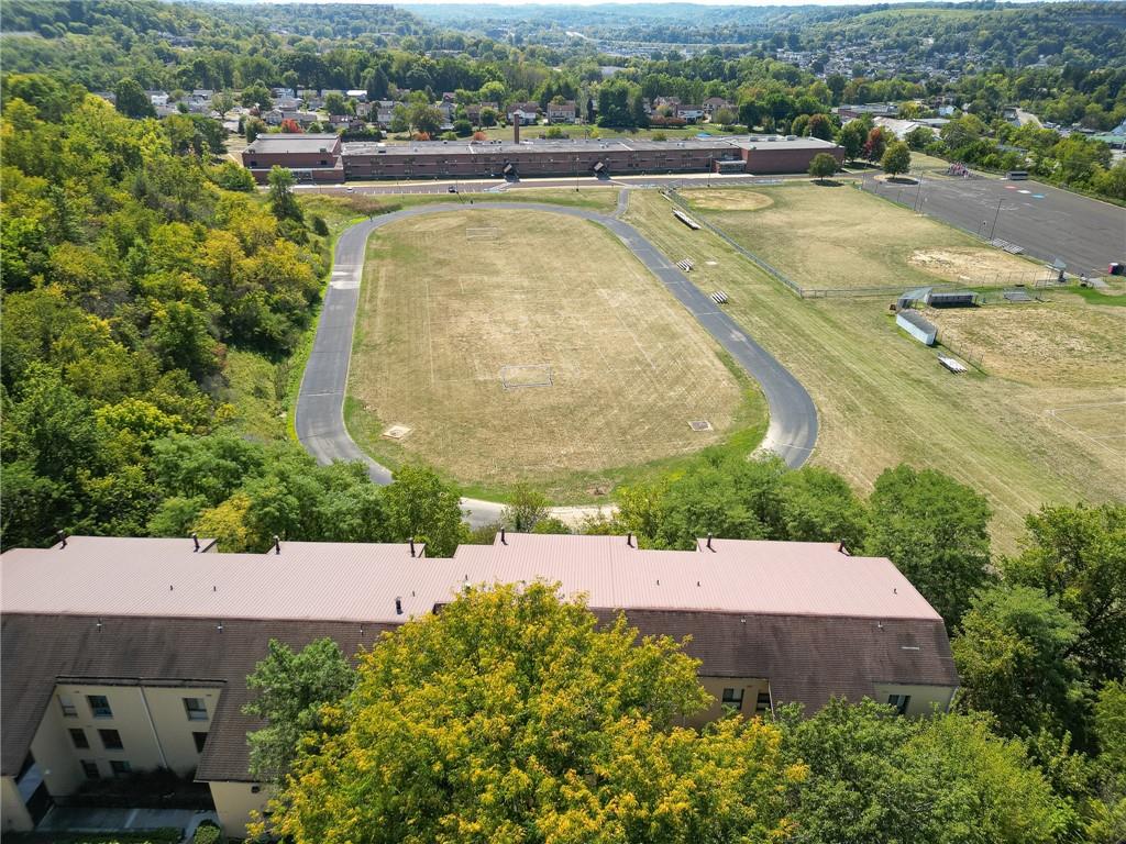 2034 Swallow Hill Road, Unit 326 Pittsburgh, PA 15220 - Photo 27 of 28 an aerial view of a house with a garden and lake view