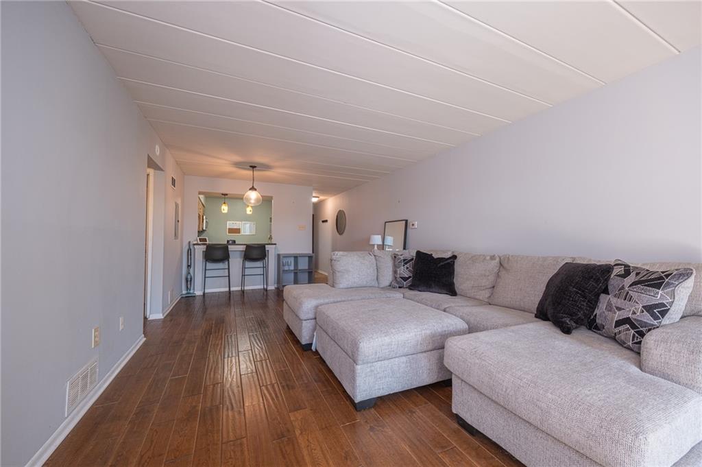 2034 Swallow Hill Road, Unit 326 Pittsburgh, PA 15220 - Photo 10 of 28 a living room with furniture and wooden floor