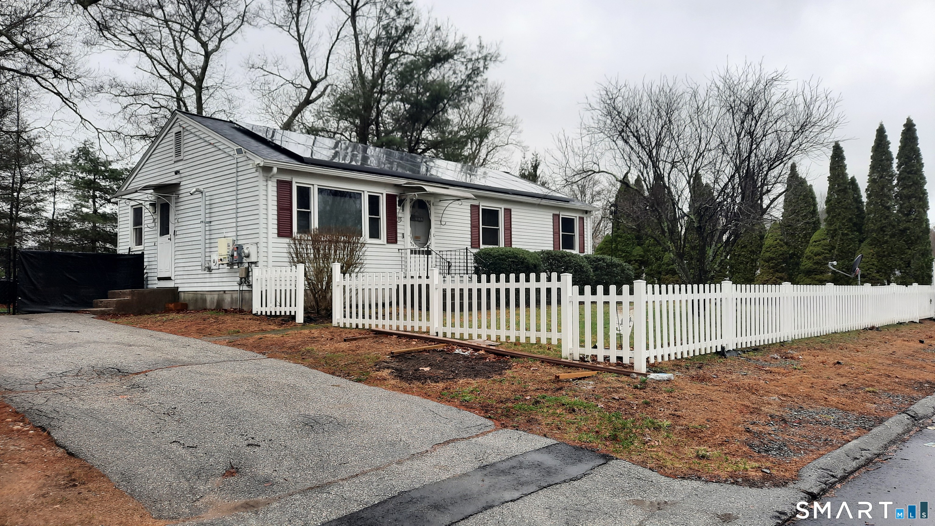 68 Viens Street Putnam, CT 06260 - Photo 1 of 20 a front view of a house with a garden