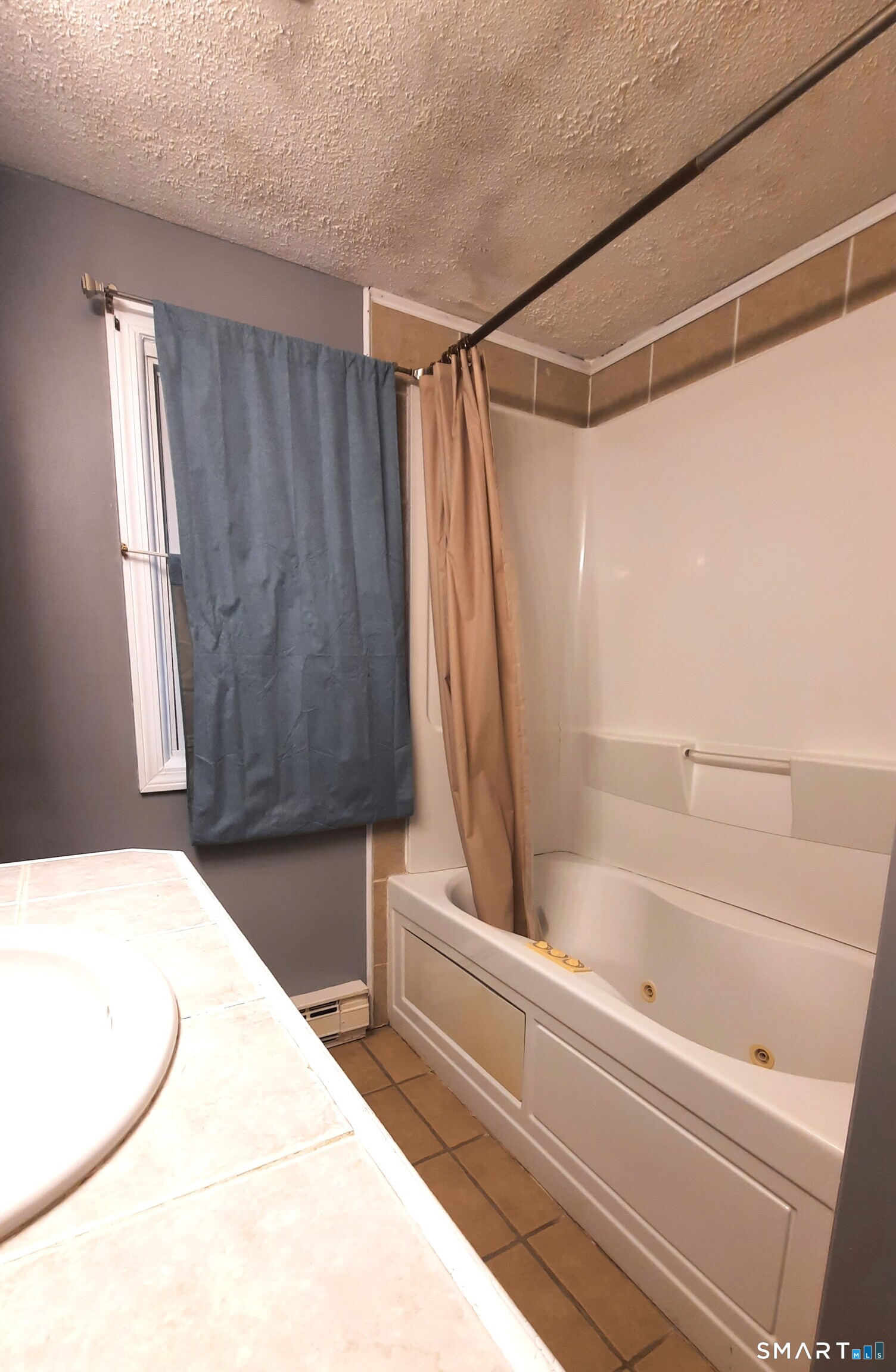 68 Viens Street Putnam, CT 06260 - Photo 13 of 20 a bathroom with a bathtub and a shower