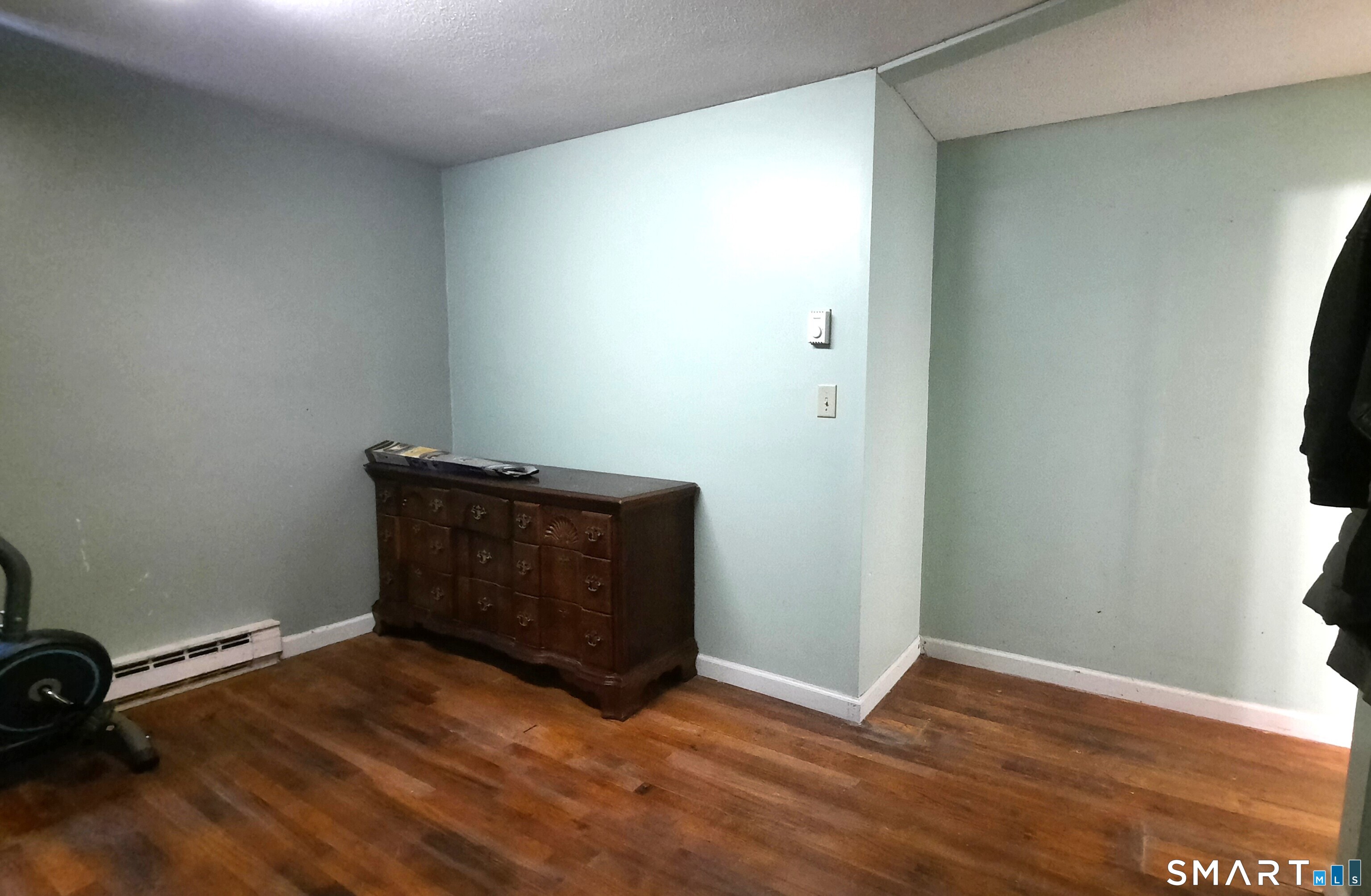 68 Viens Street Putnam, CT 06260 - Photo 14 of 20 an empty room with wooden floor and windows