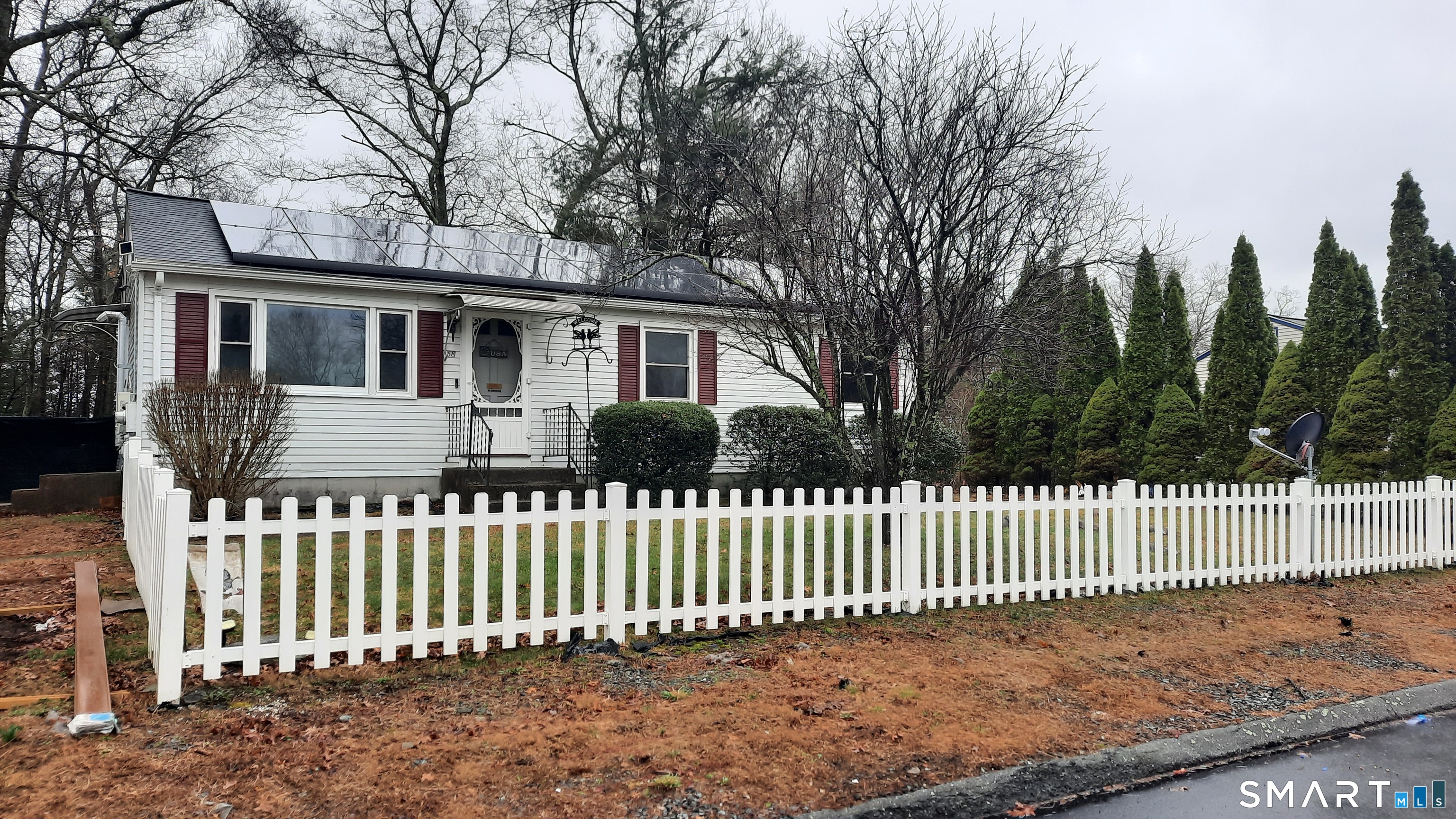 68 Viens Street Putnam, CT 06260 - Photo 20 of 20 a front view of a house with a garden
