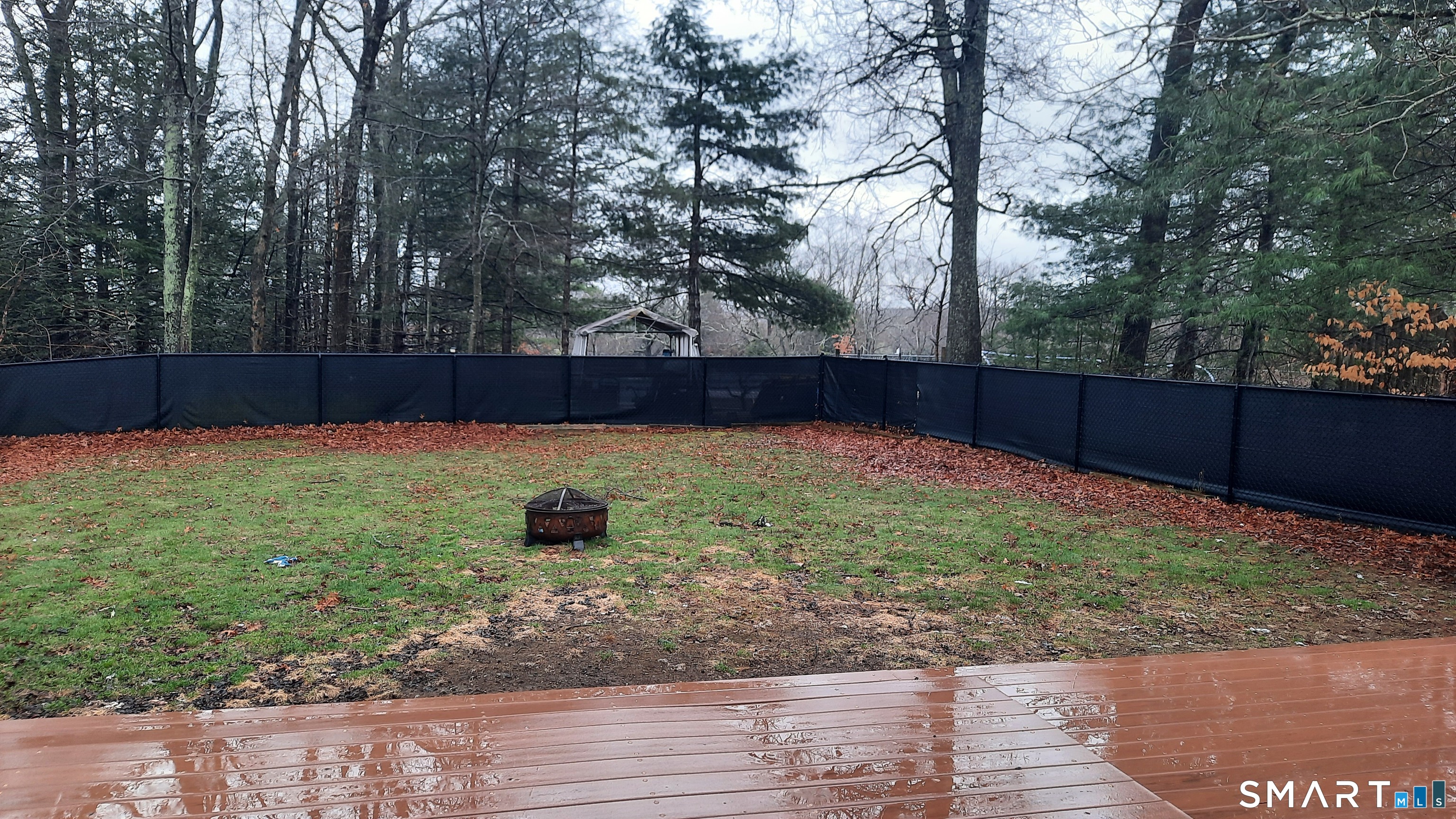 68 Viens Street Putnam, CT 06260 - Photo 2 of 20 a view of a backyard with large trees