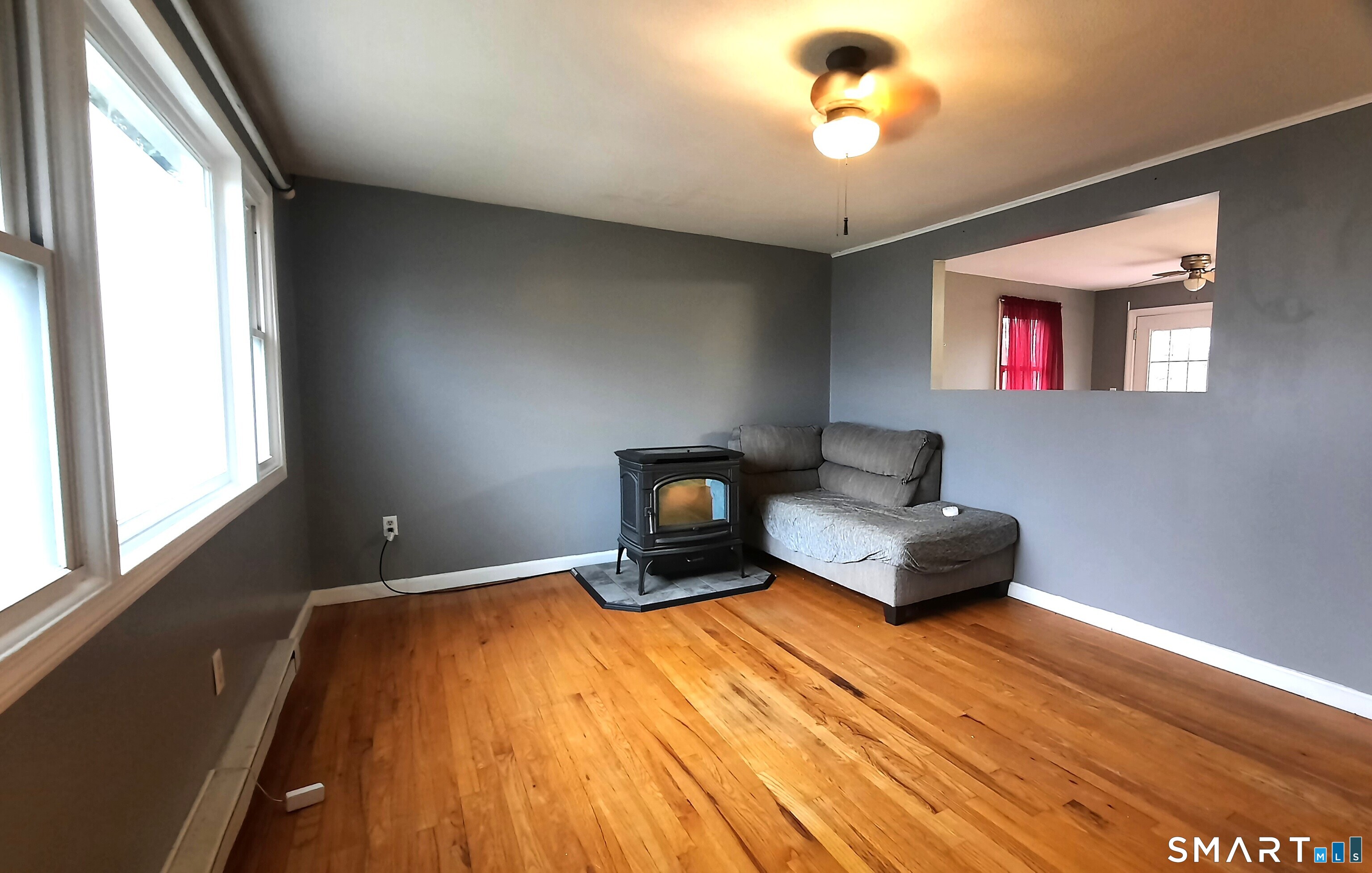68 Viens Street Putnam, CT 06260 - Photo 8 of 20 a living room with furniture and a window