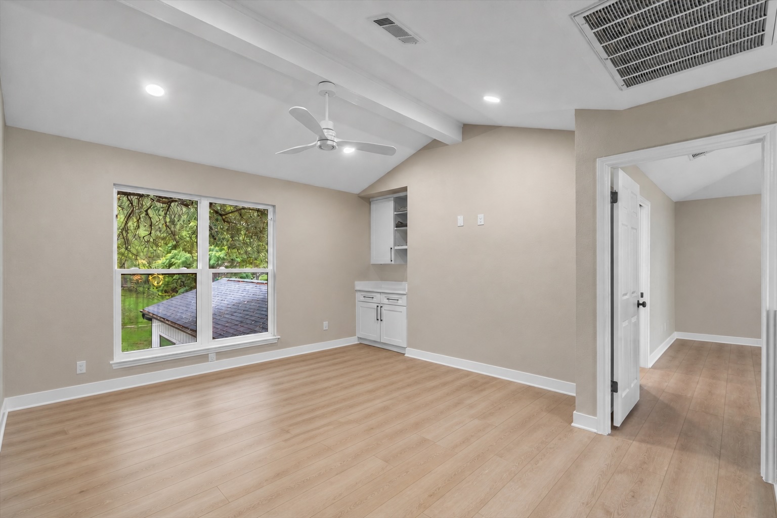 307 Hurst Creek Road Austin, TX 78734 - Photo 23 of 40 Vaulted ceiling with exposed beams, wood-finish flooring, recessed lighting, and a contemporary ceiling fan