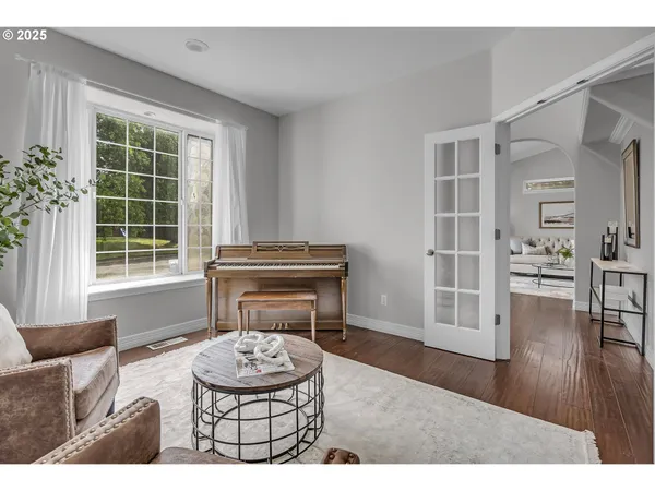 a living room with furniture potted plant and a window