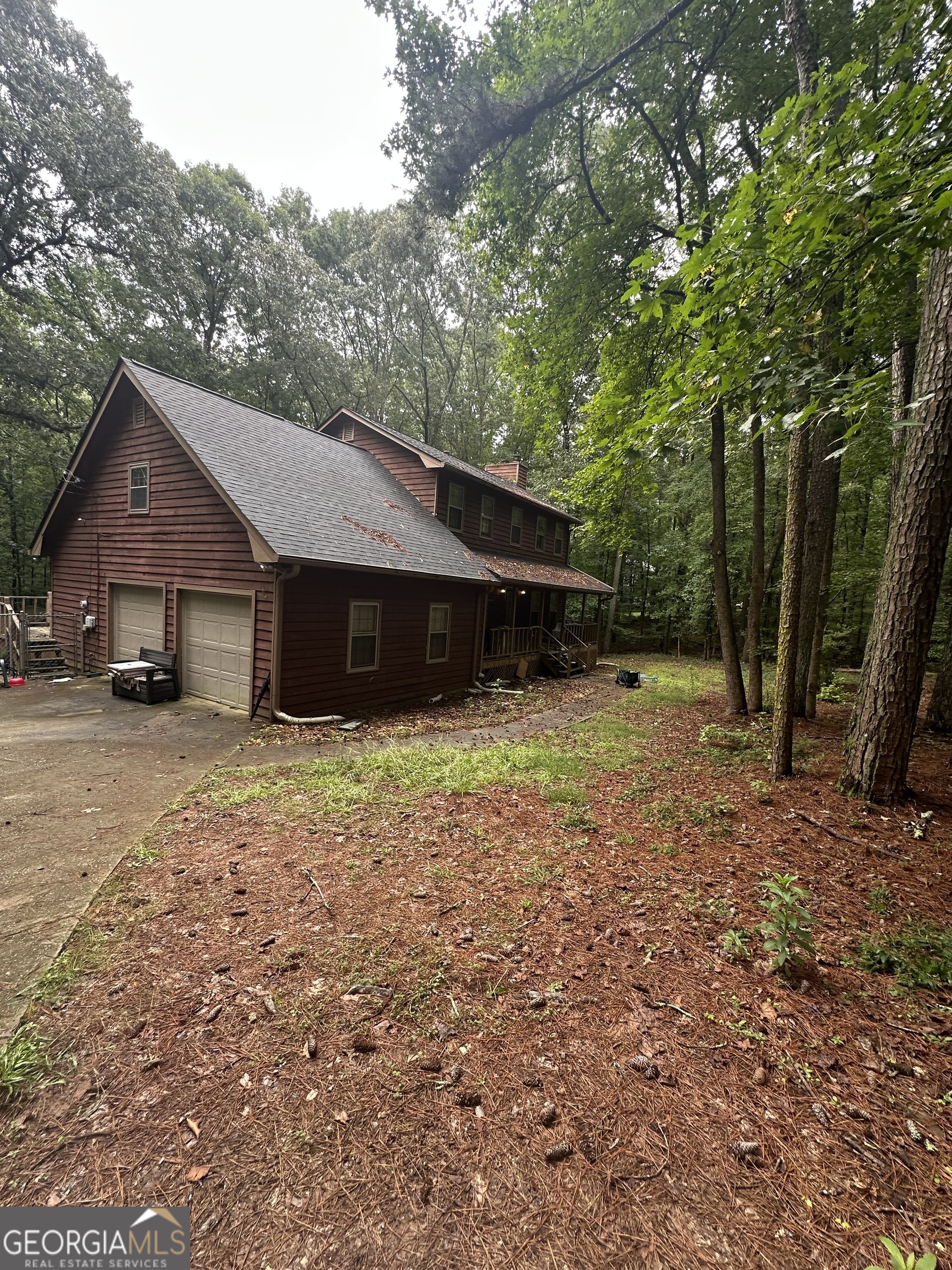 307 Winding Stream Trail Southwest Conyers, GA 30094 - Photo 1 of 33 a view of a house with a yard and large tree