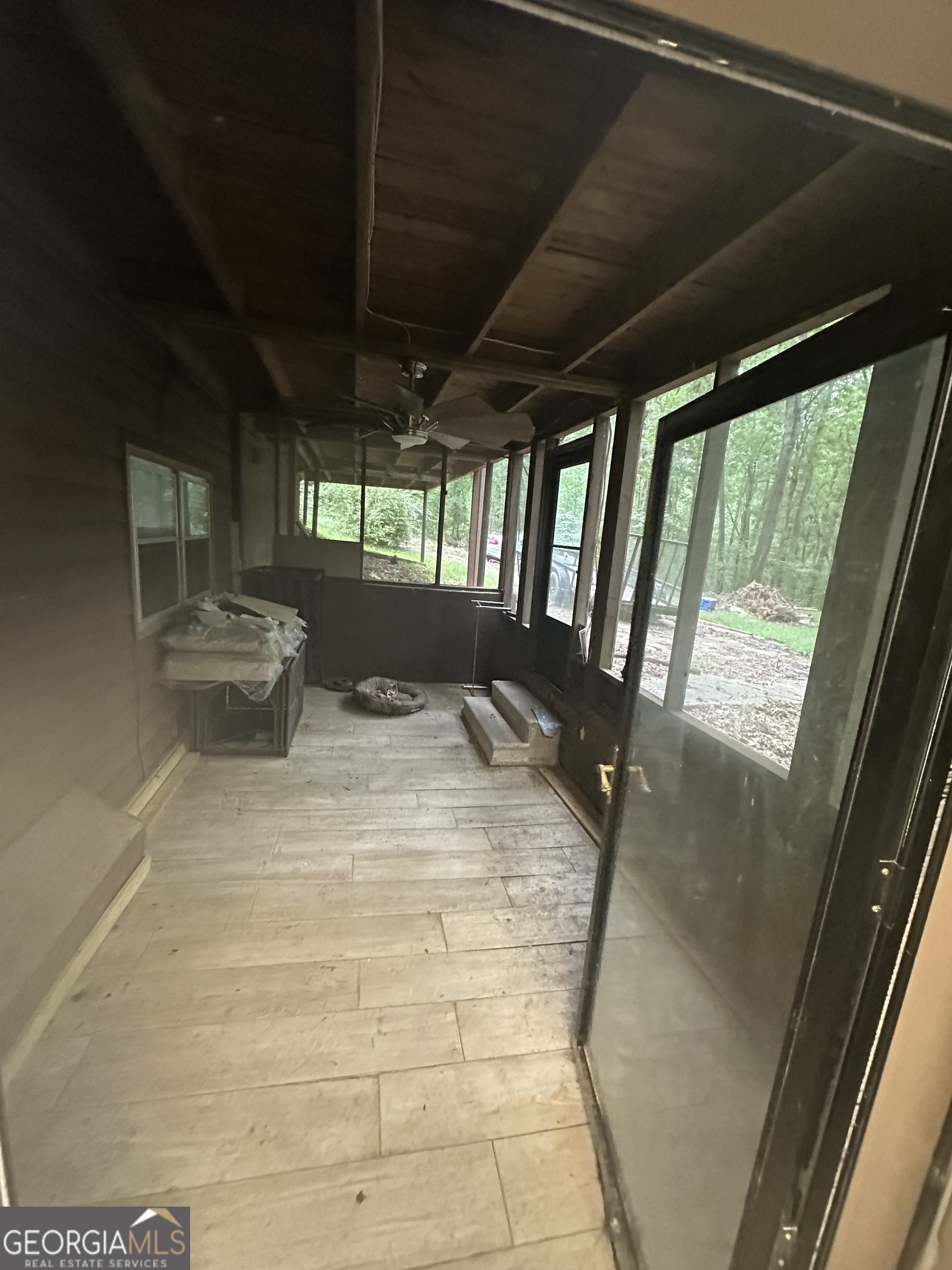 307 Winding Stream Trail Southwest Conyers, GA 30094 - Photo 21 of 33 a view of empty room with wooden floor and fan