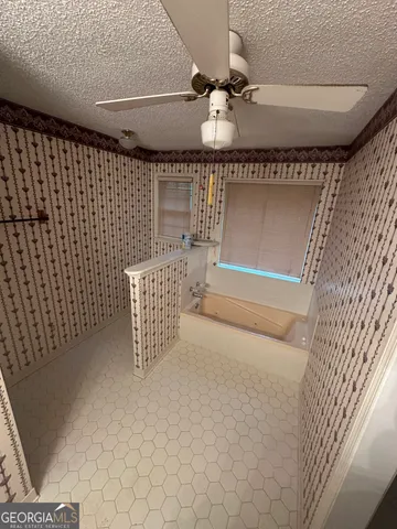 a view of an empty room with a windows