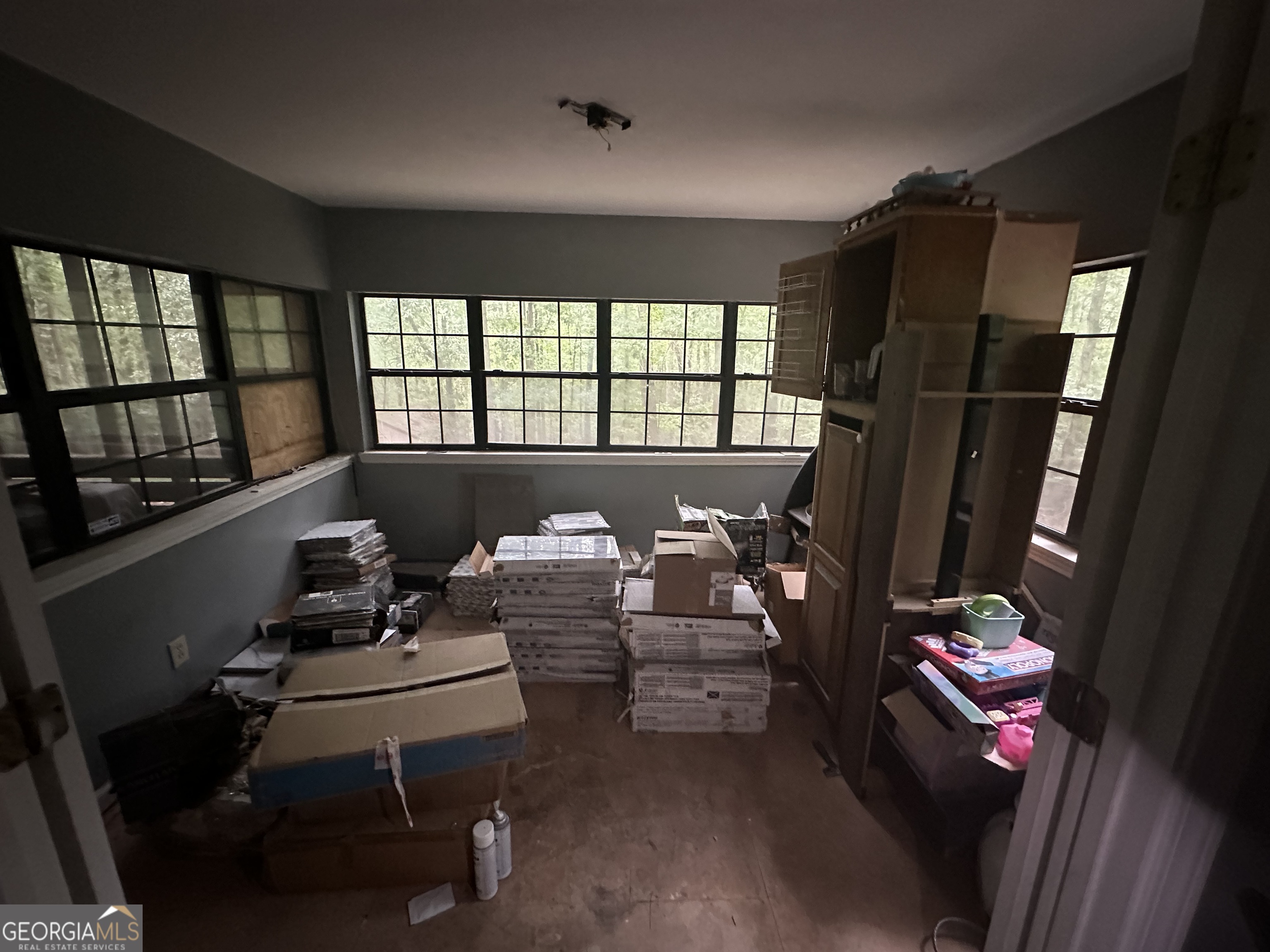 307 Winding Stream Trail Southwest Conyers, GA 30094 - Photo 3 of 33 a living room with furniture and a floor to ceiling window
