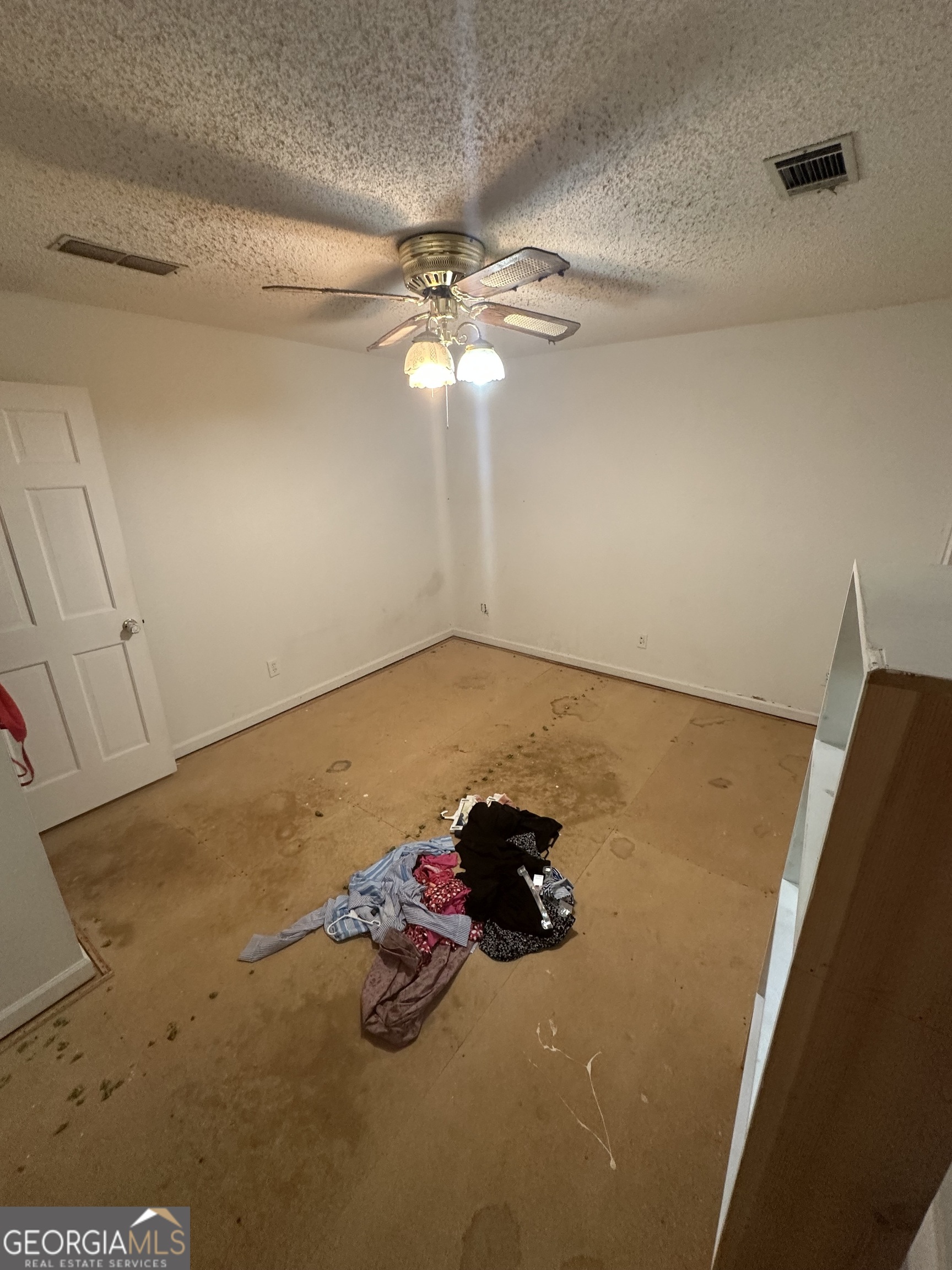 307 Winding Stream Trail Southwest Conyers, GA 30094 - Photo 6 of 33 a view of a room with window and ceiling fan