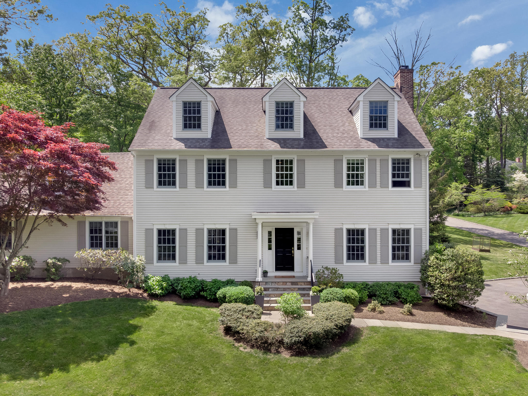 155 Hillcrest Road New Canaan, CT 06840 - Photo 2 of 32 front view of a house with a yard