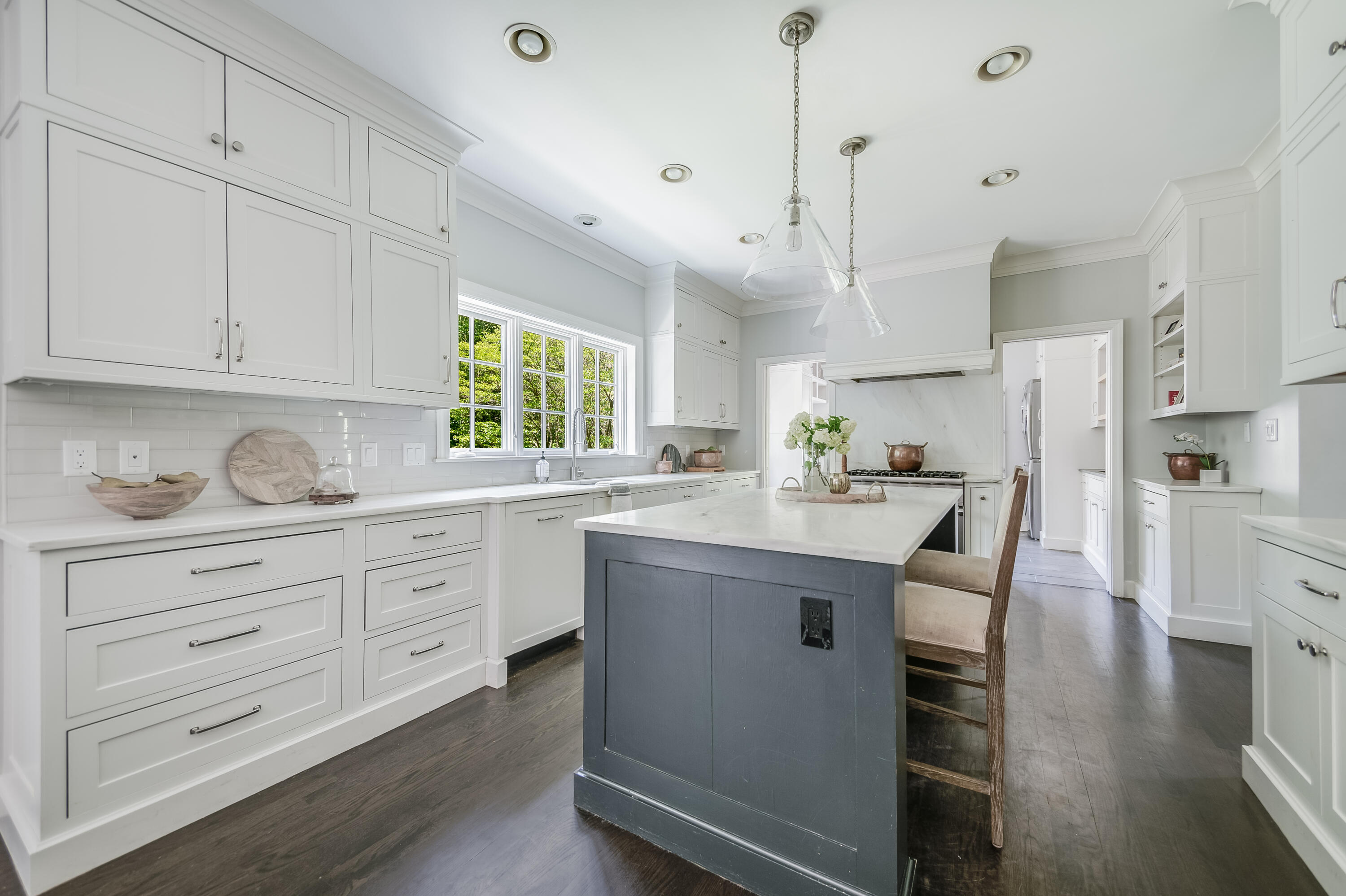 155 Hillcrest Road New Canaan, CT 06840 - Photo 11 of 32 a kitchen with granite countertop cabinets a sink a window and stainless steel appliances
