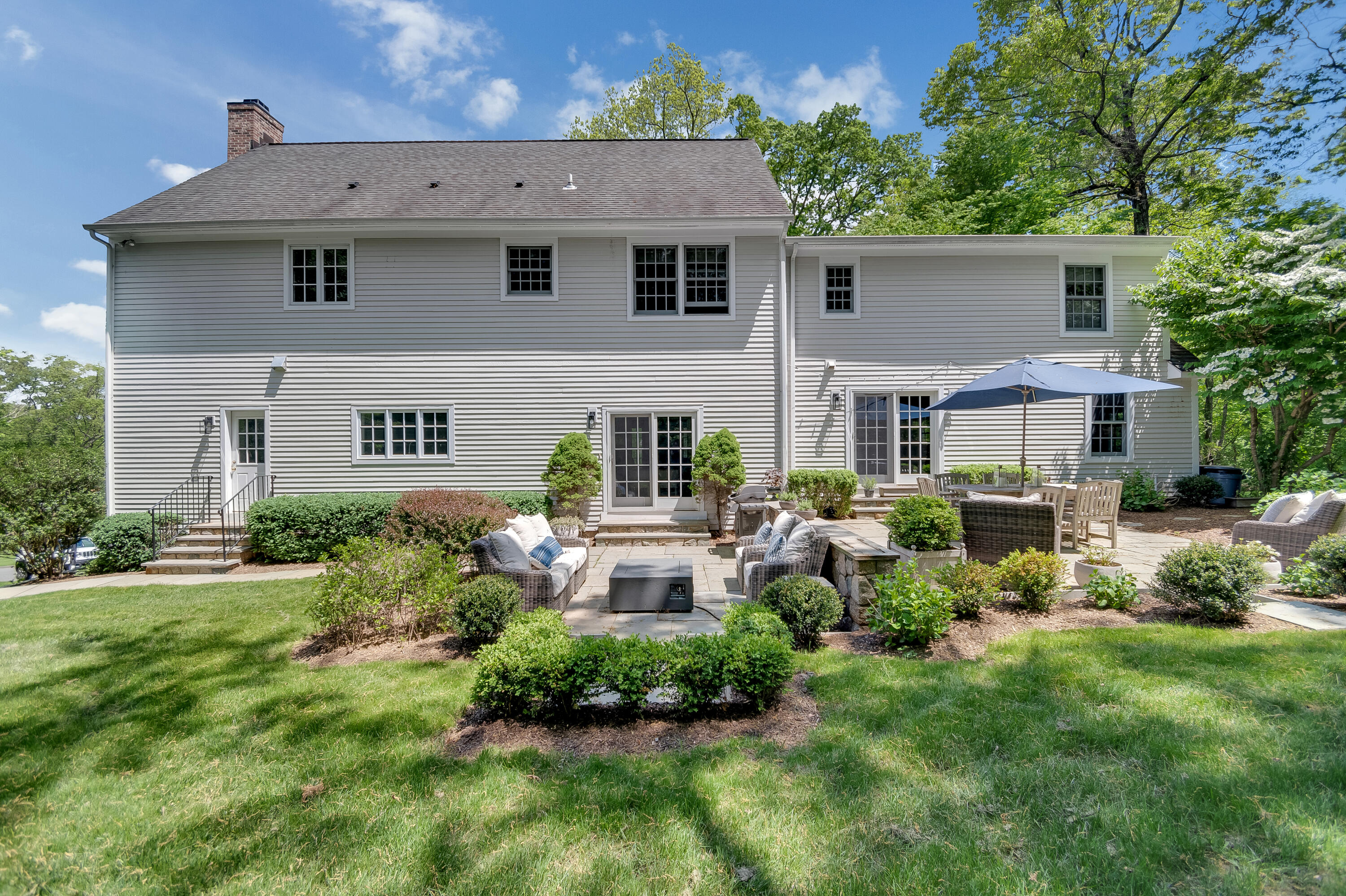 155 Hillcrest Road New Canaan, CT 06840 - Photo 32 of 32 a front view of a house with a yard