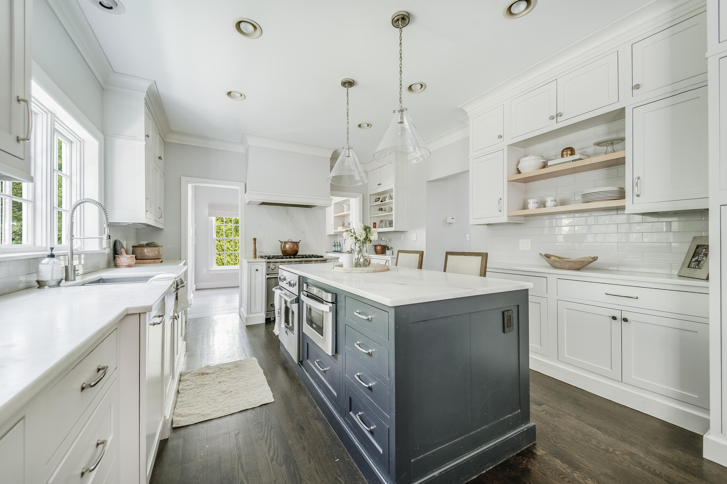 155 Hillcrest Road New Canaan, CT 06840 - Photo 8 of 32 a kitchen with stainless steel appliances granite countertop a sink a stove and a refrigerator