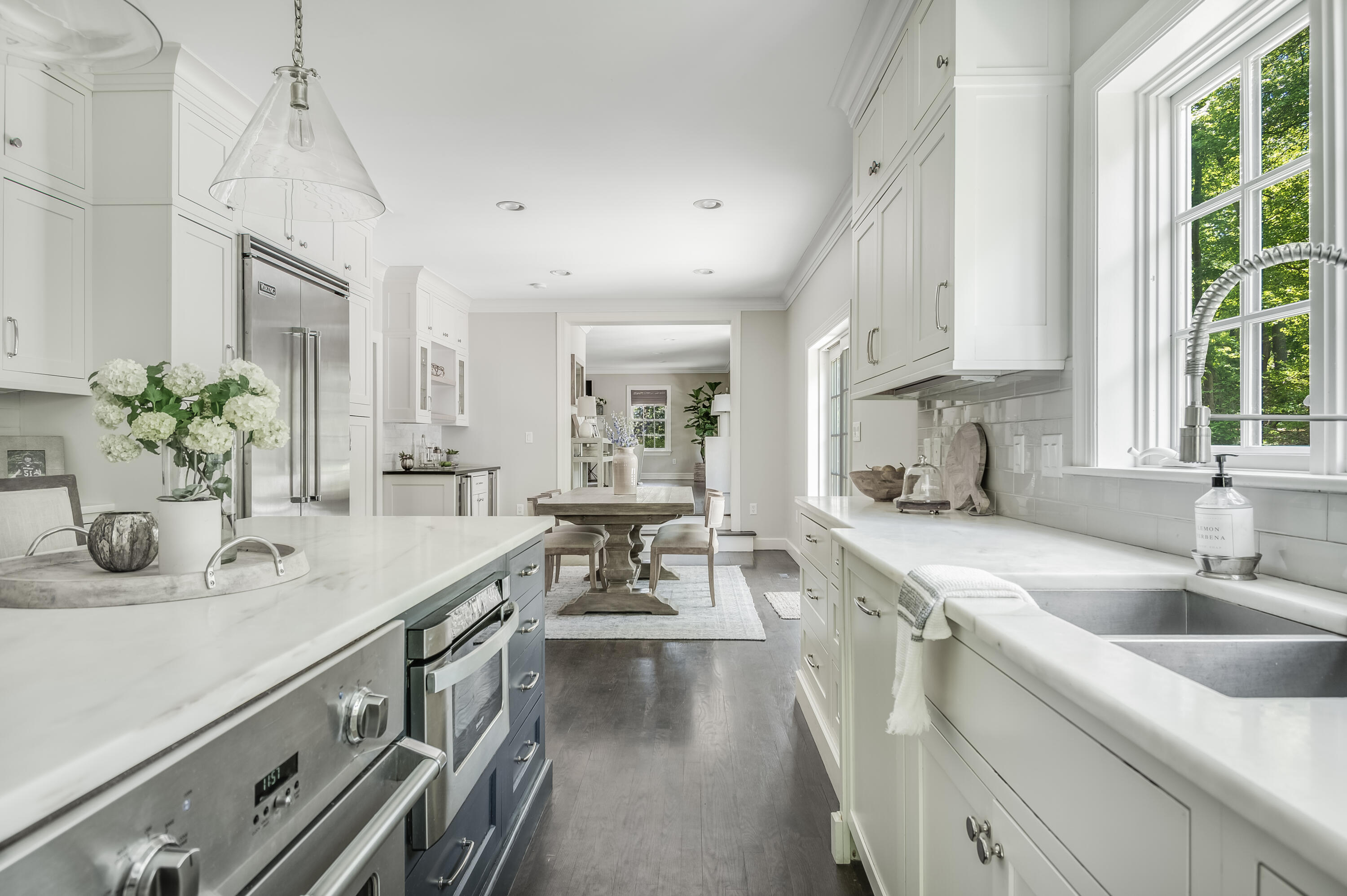 155 Hillcrest Road New Canaan, CT 06840 - Photo 9 of 32 a kitchen with stainless steel appliances a sink stove and cabinets