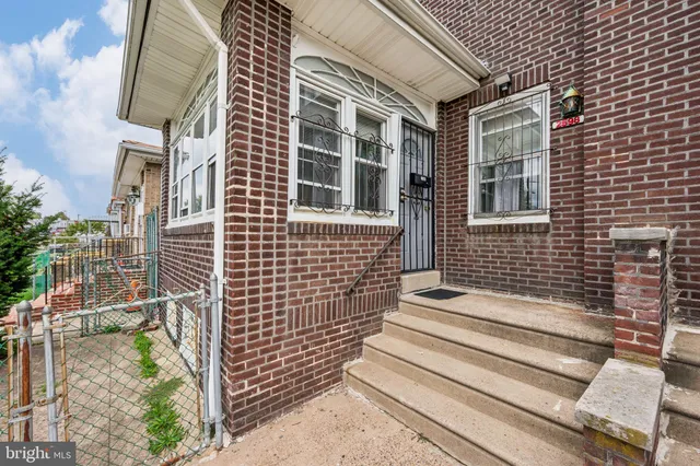 a view of a brick building with many windows