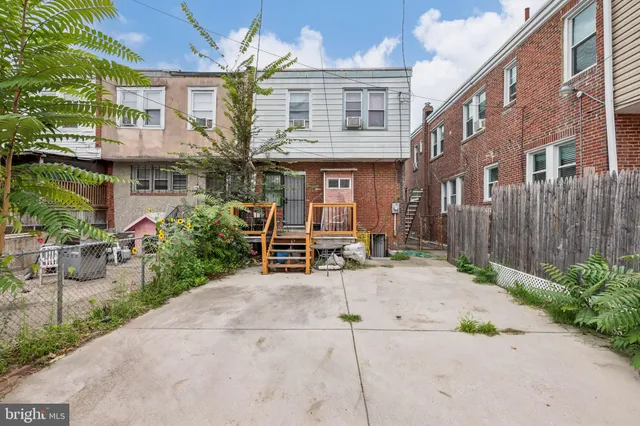 a view of a building with sitting area
