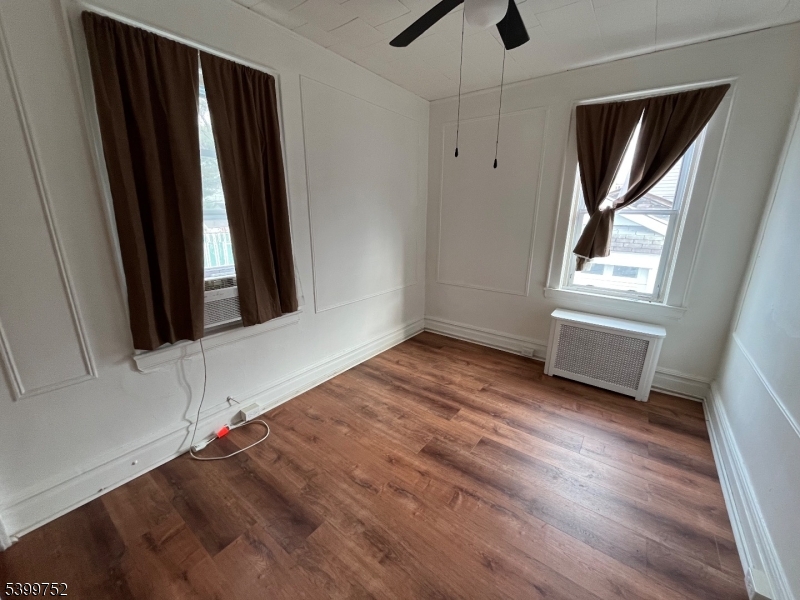 202 North 17th Street, Unit 1 Bloomfield, NJ 07003 - Photo 3 of 13 an empty room with windows