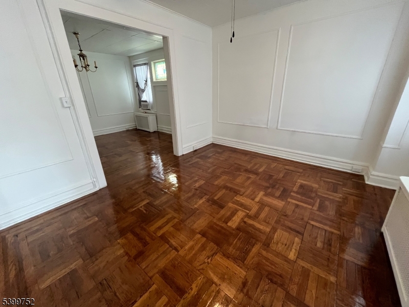 202 North 17th Street, Unit 1 Bloomfield, NJ 07003 - Photo 5 of 13 wooden floor in an empty room