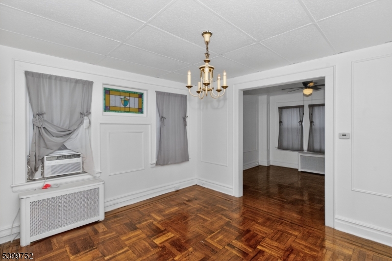 202 North 17th Street, Unit 1 Bloomfield, NJ 07003 - Photo 7 of 13 a view of a room with wooden floor and cabinet